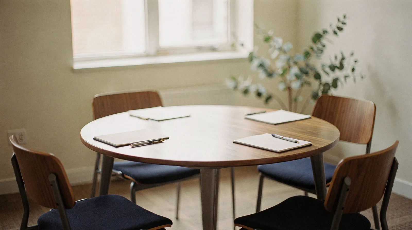 A small meeting table set for a supervision group
